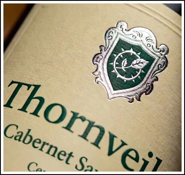 Wine bottle label showing a crest logo for Thornveil Cabernet Sauvignon